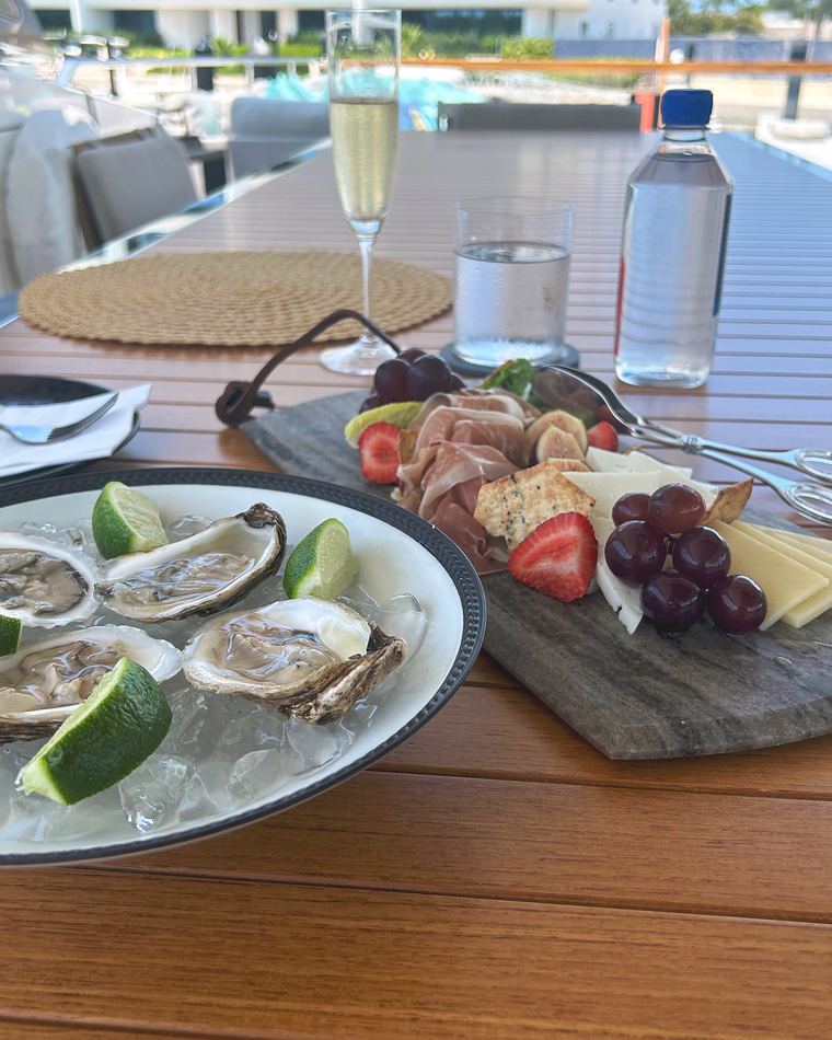 Oysters and a charcuterie board on deck