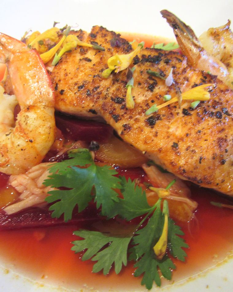 Blackened fish with prawns, beetroot and coriander in a light broth