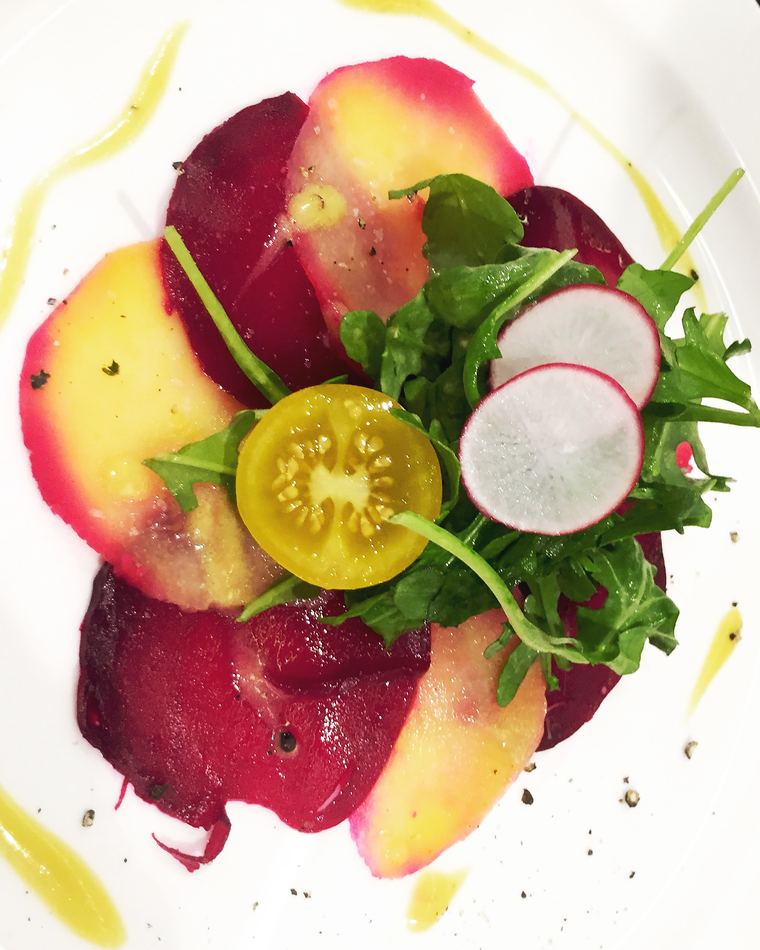 Beetroot and peach carpaccio with radish and yellow tomato